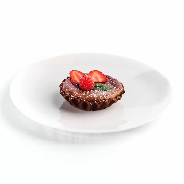 Tartaleta tibia de chocolate semiamargo con frutos rojos.