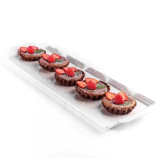 Tartaleta tibia de chocolate semiamargo con frutos rojos.